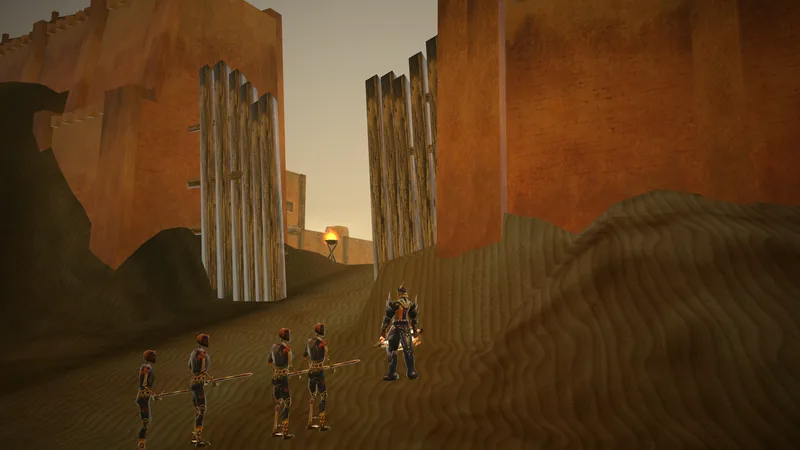Four Skeleton Soldiers with spears face a swordsman on the sand in front of the Desert's towering wall and its wooden gate, a torch burning beyond.