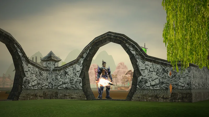 A swordsman in dark blue armour stands in a round moon gate of the Xiah Prairie village wall, blossom trees and market stalls behind him, a willow on the right and a cloudy sky above.